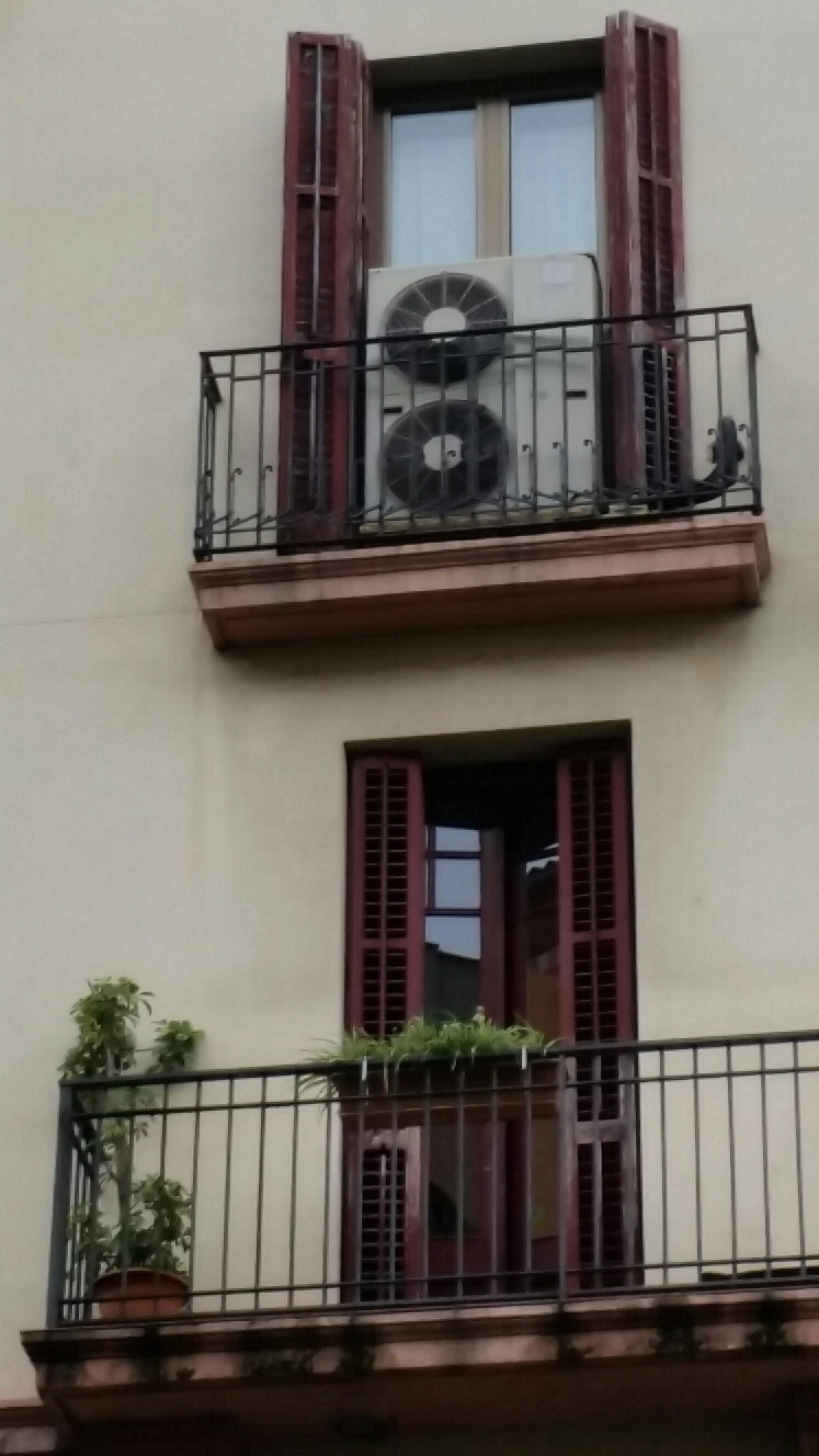 Not a good example of mini split condenser on a Spanish balcony